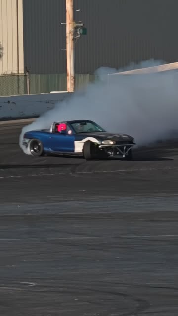 Miata drifting on track in a photograph shared by EMP Motorsports